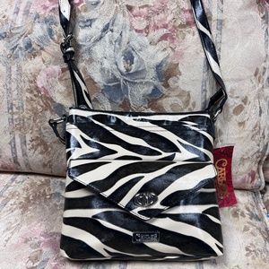 Carlos Santana Zebra Print Crossbody Purse New Without tag . I took it off